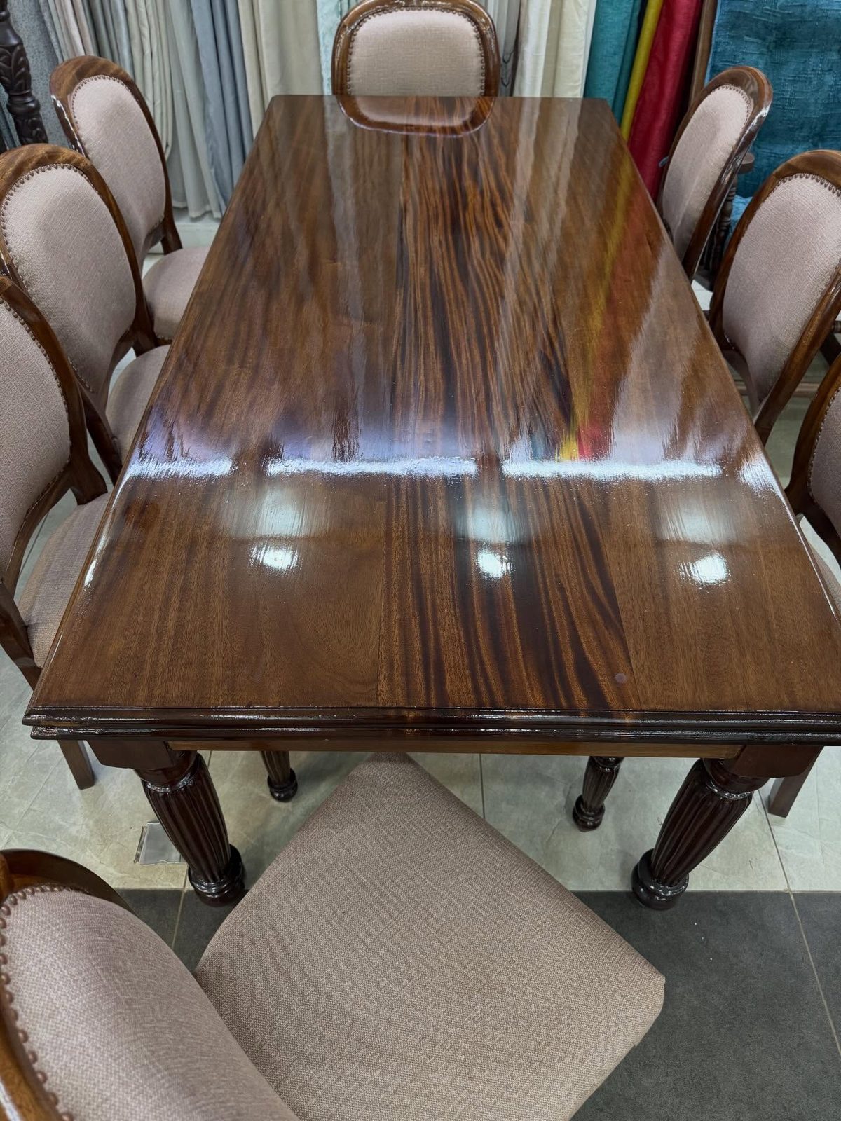 Solid wood dining table with upholstered chairs